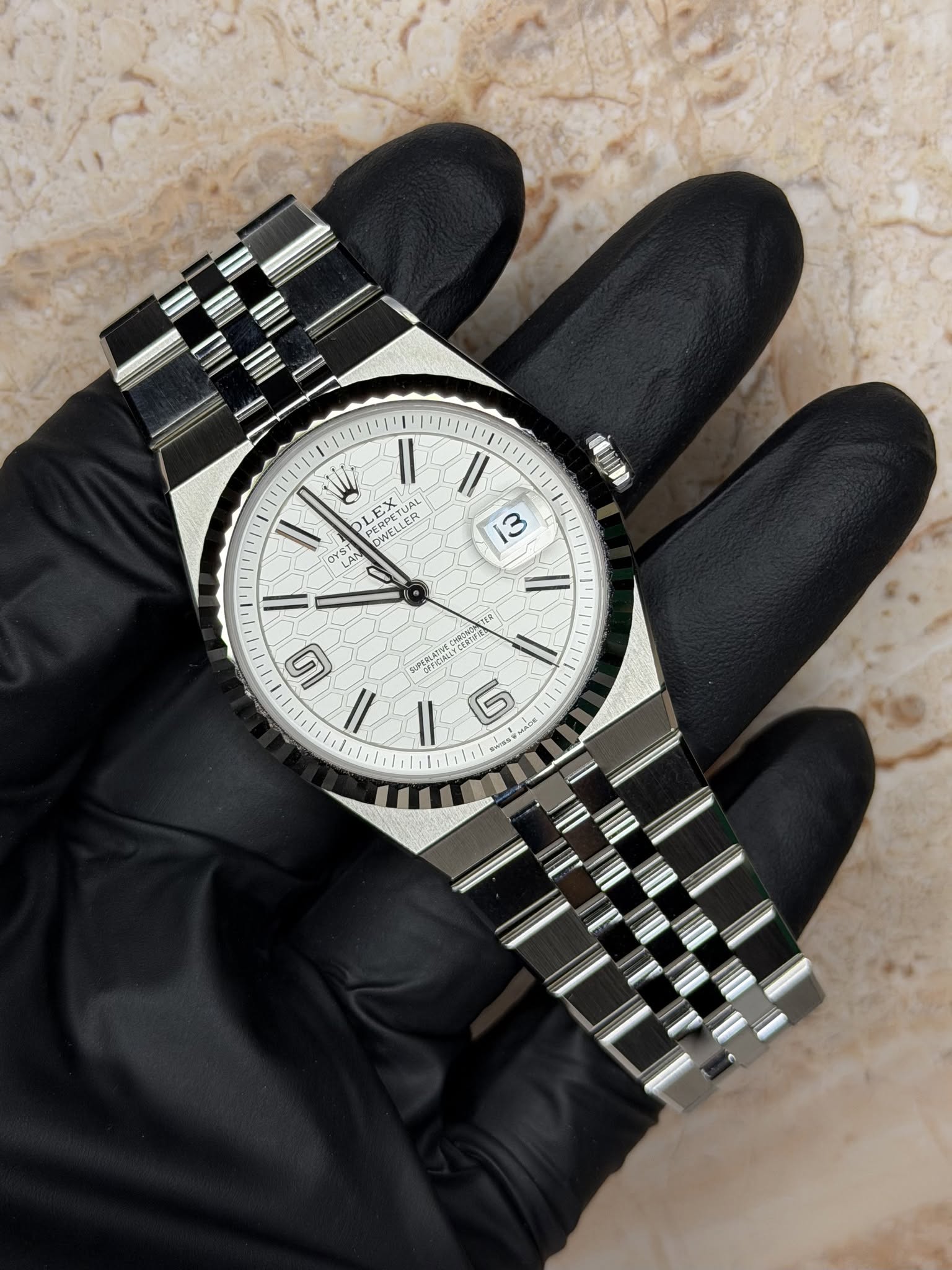 May be an image of wrist watch and text