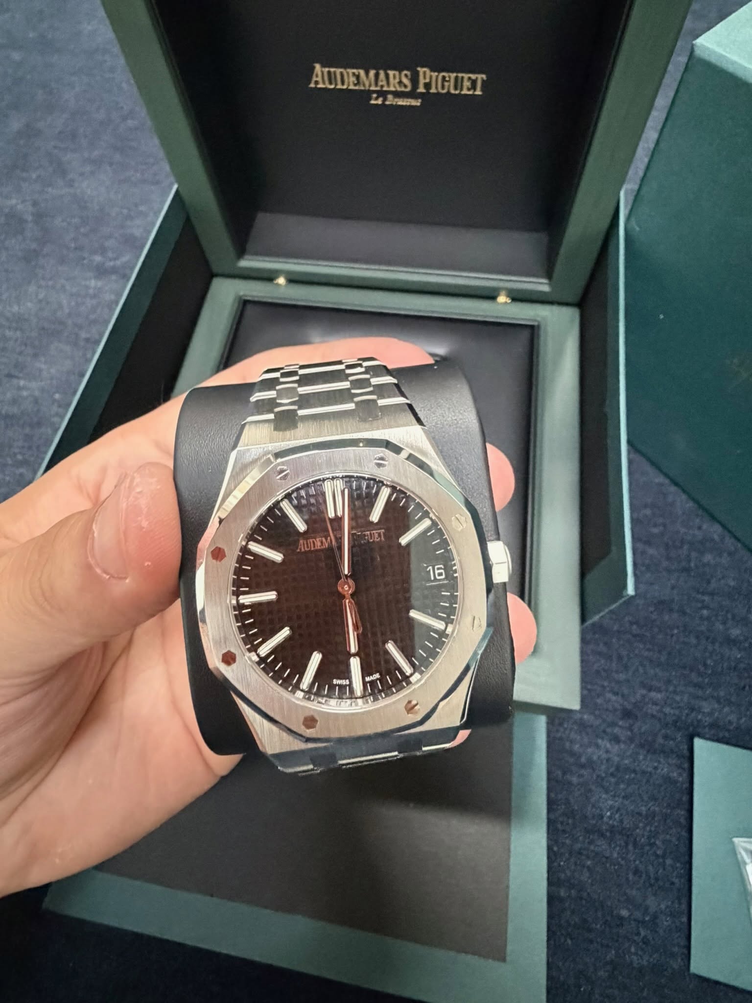 May be an image of wrist watch and text