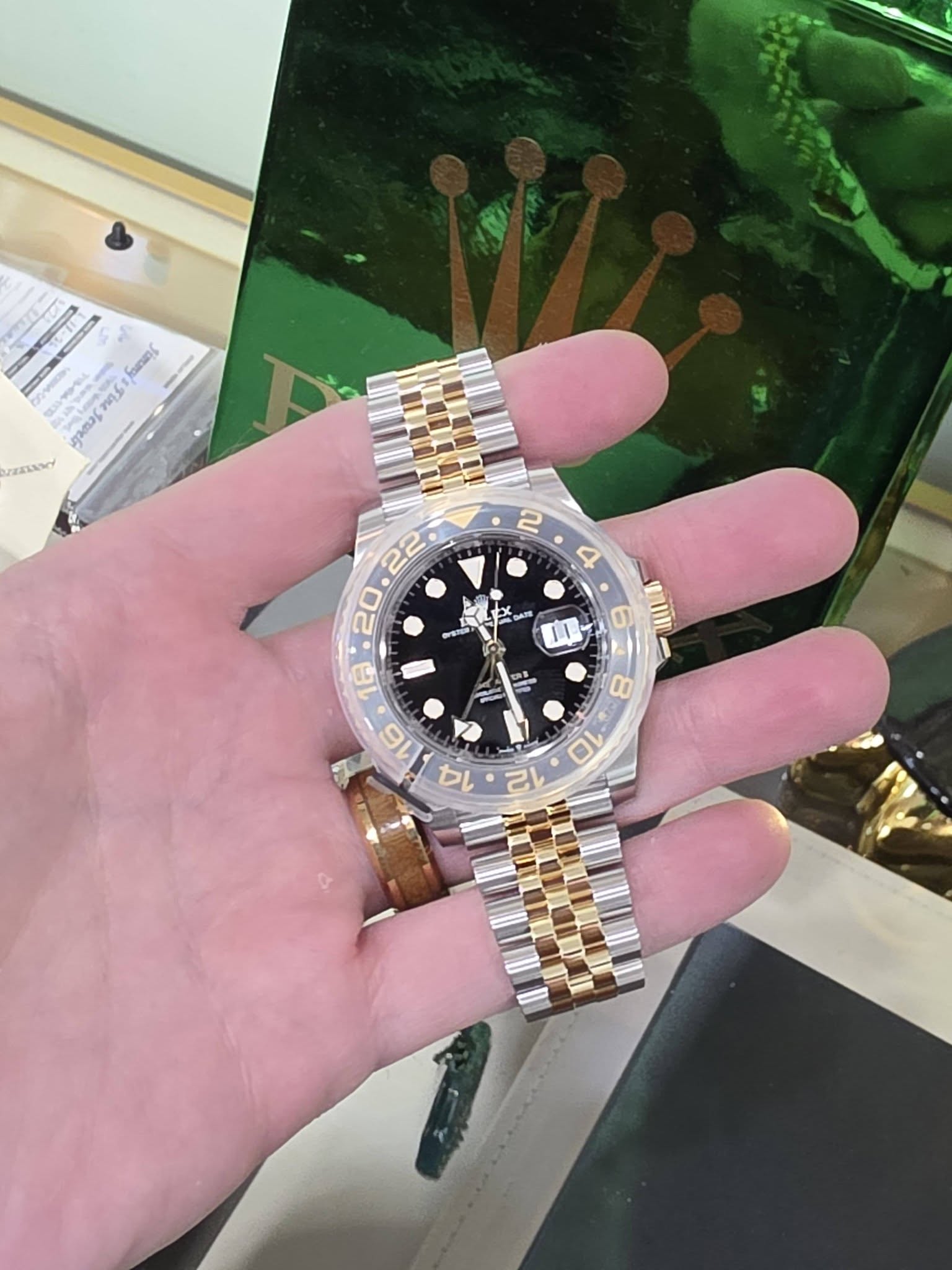 May be an image of wrist watch and text