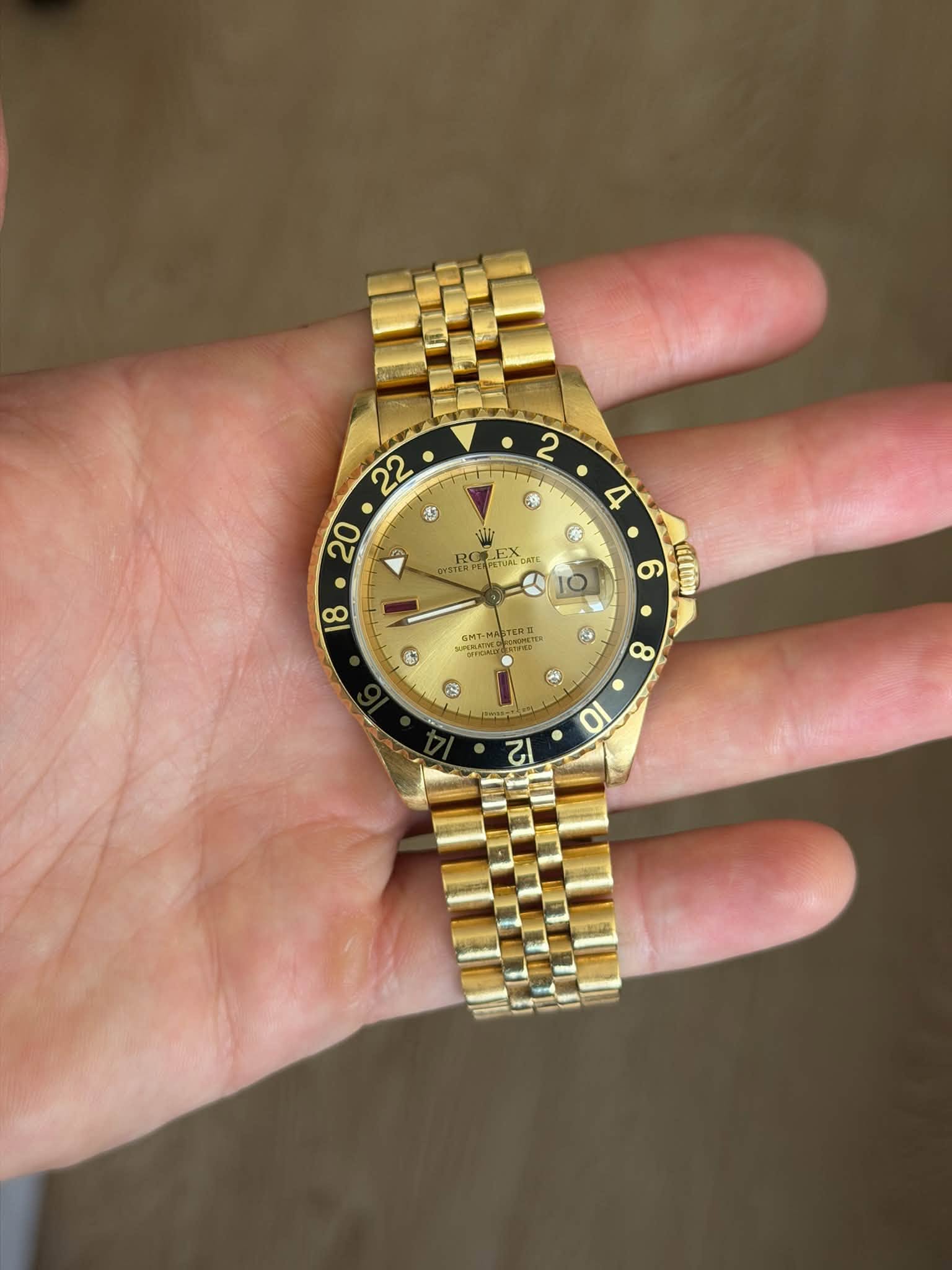 May be an image of wrist watch and text