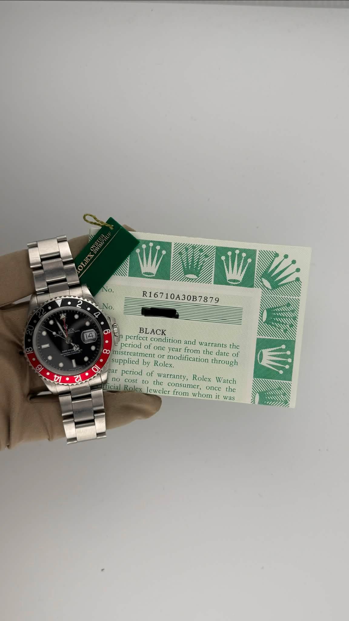 May be an image of digital watch and text that says 'No. R16710A30B7879 R167 BLACK perfect condition period onev from warrants the လ mistreatment eriodofoneyearfrom.thedatc tment…