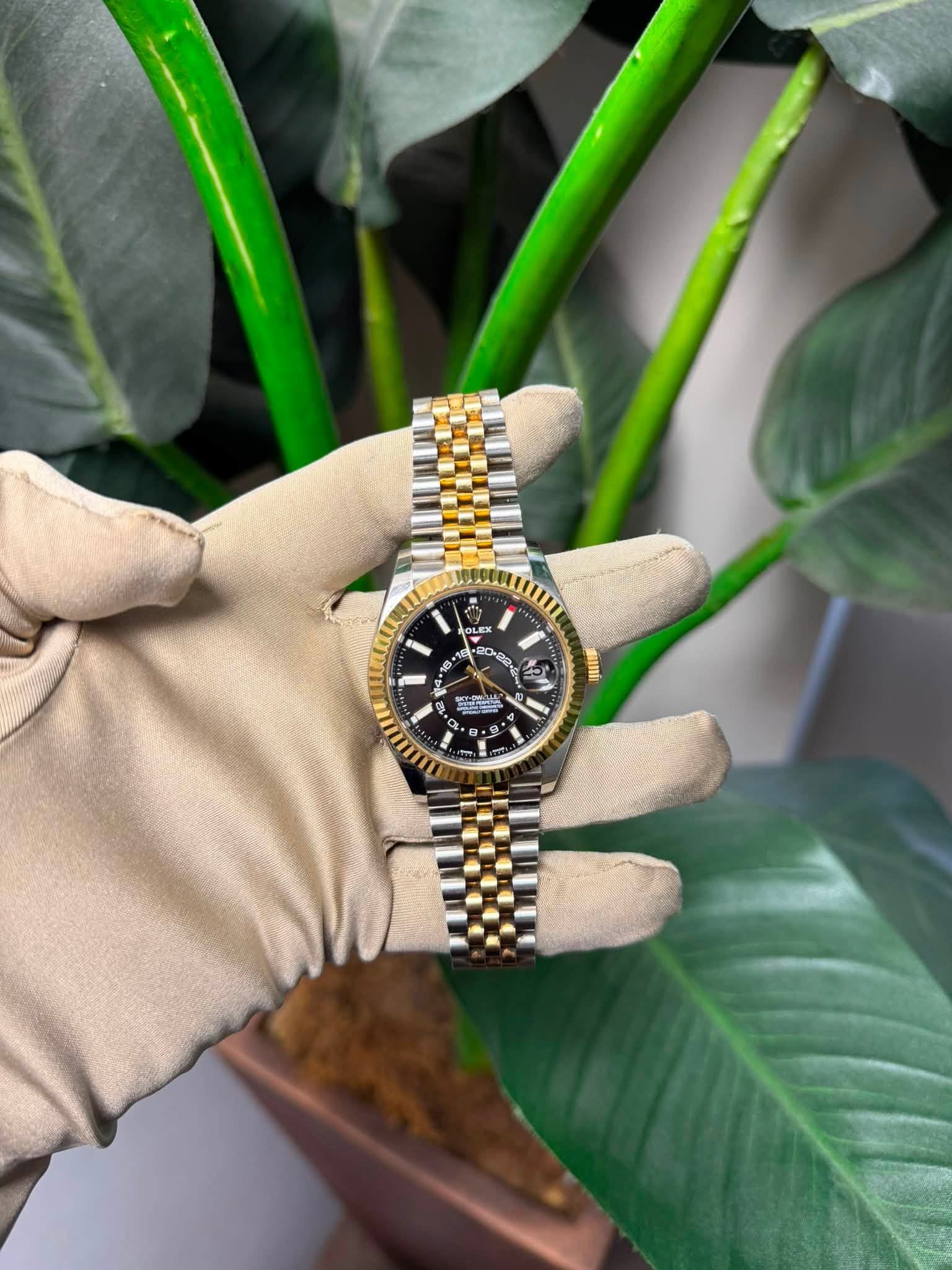 May be an image of wrist watch and text
