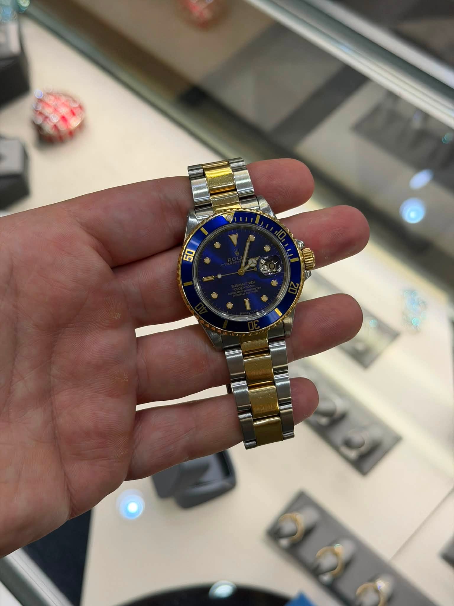 May be an image of wrist watch and text