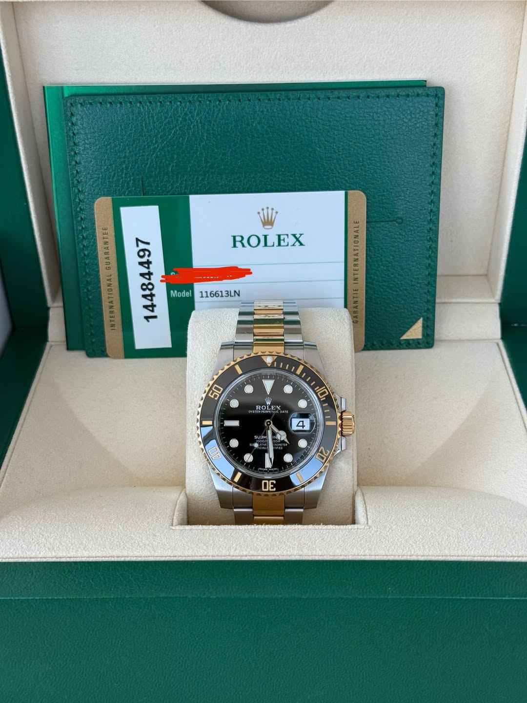 May be an image of wrist watch and text that says 'ROLEX INTERNATIONAL 26448481 さわ8 Model116613LN 116613LN Model 50 BOLEN 10 一 4 SAAM 特灣 20 OE'