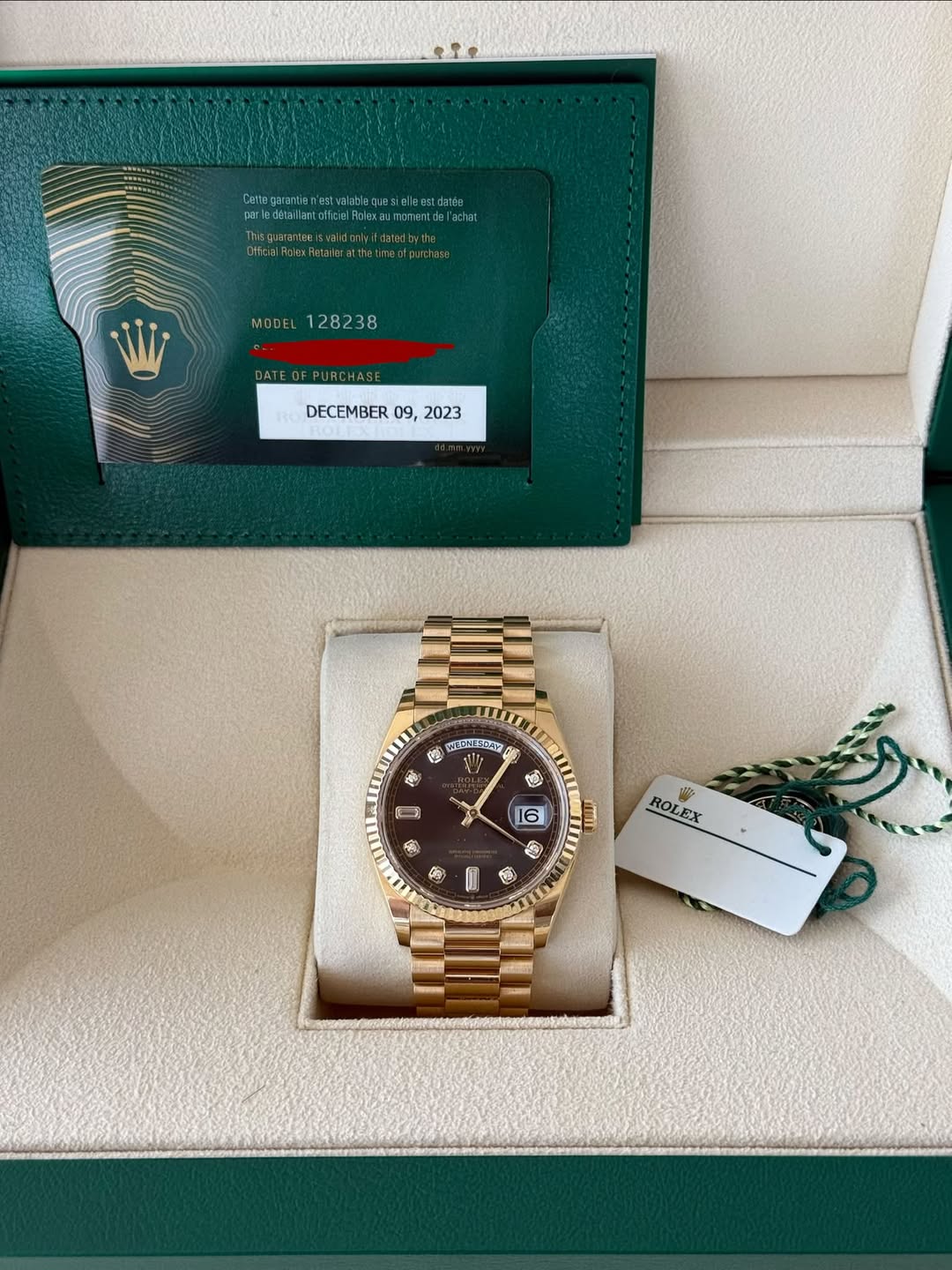 May be an image of wrist watch and text