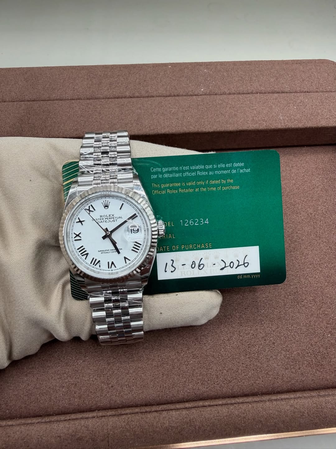 May be an image of wrist watch and text