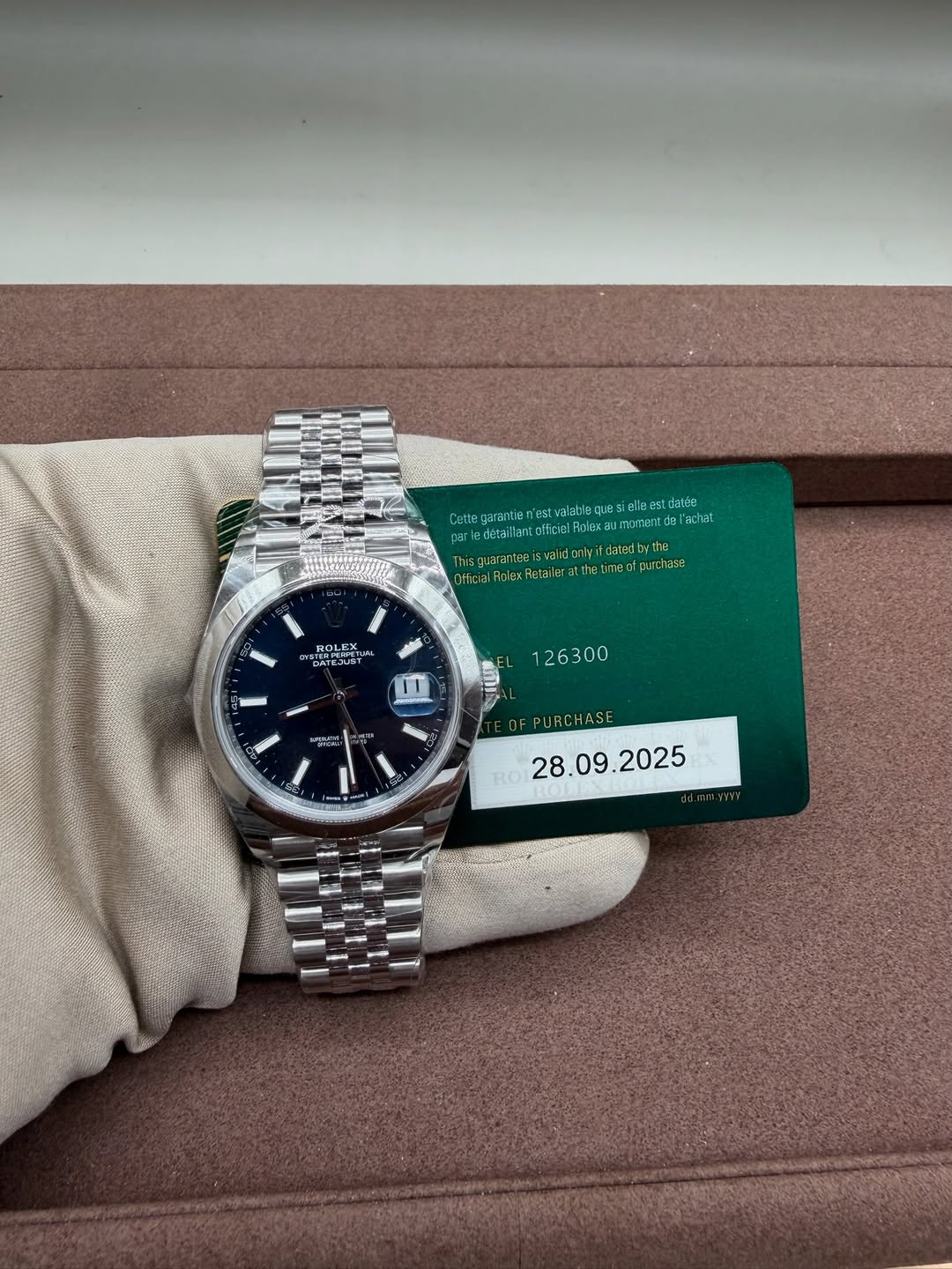 May be an image of wrist watch and text