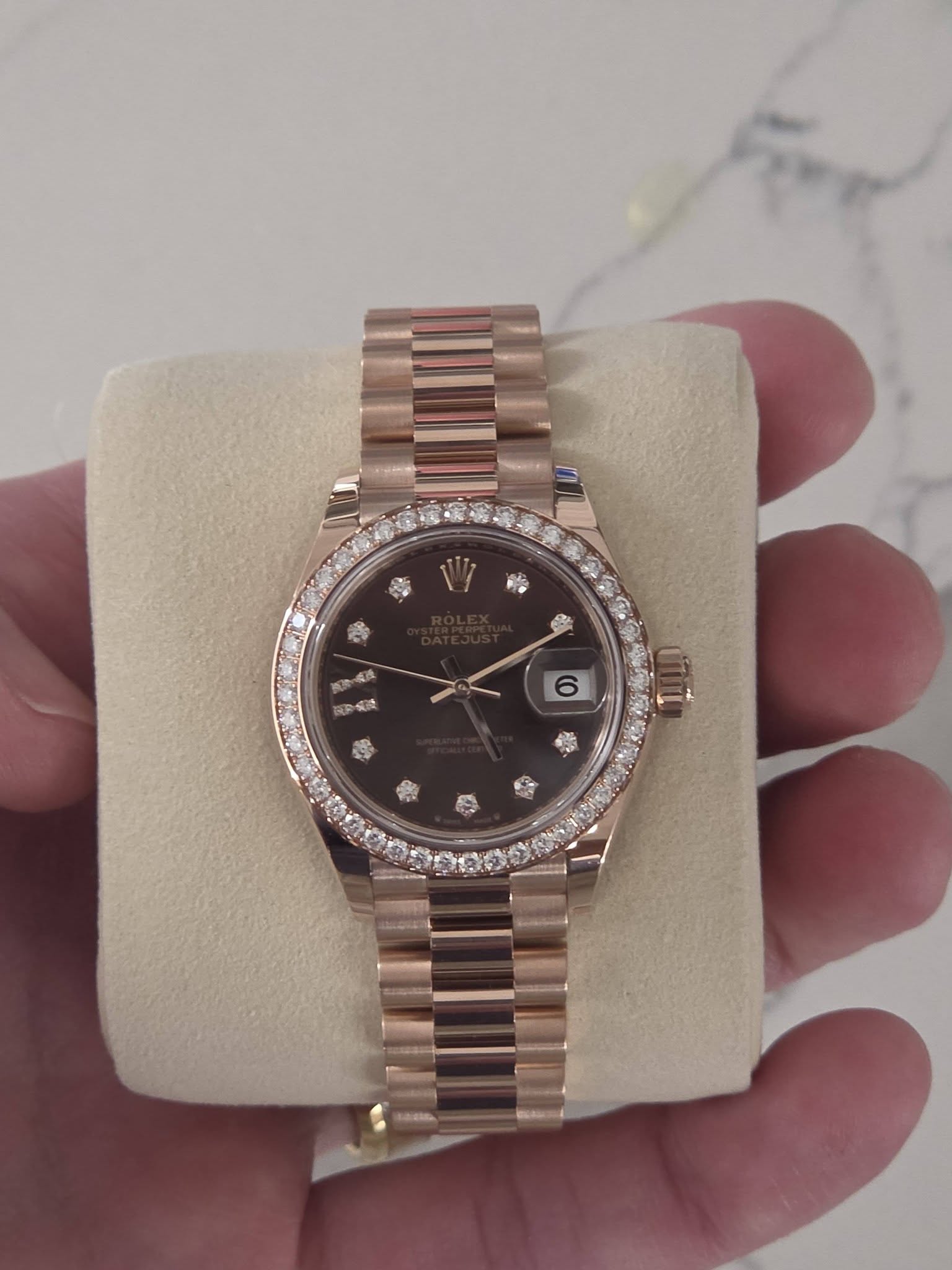 May be an image of wrist watch and text