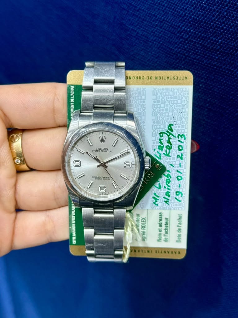 May be an image of wrist watch and text