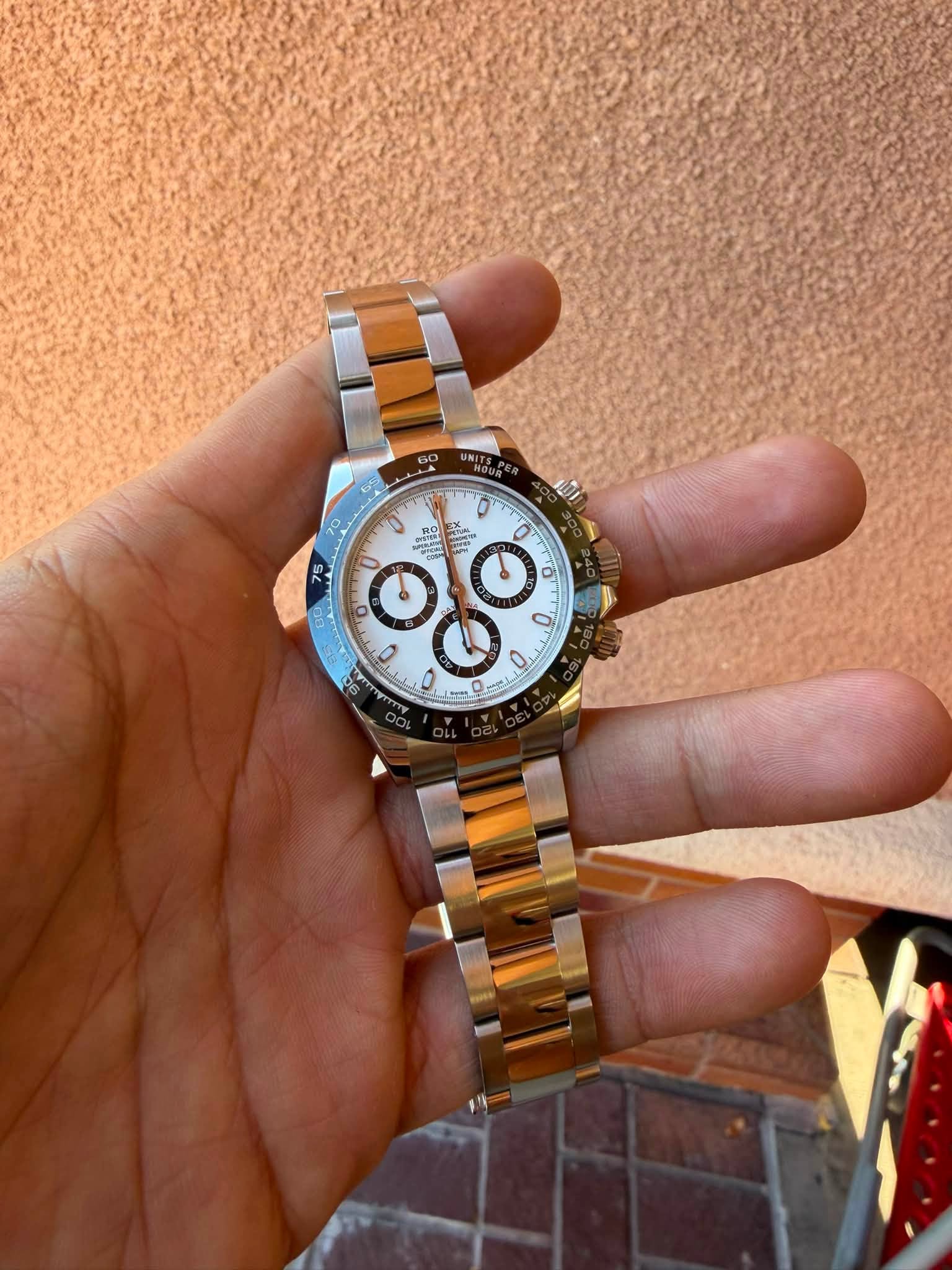 May be an image of wrist watch and text