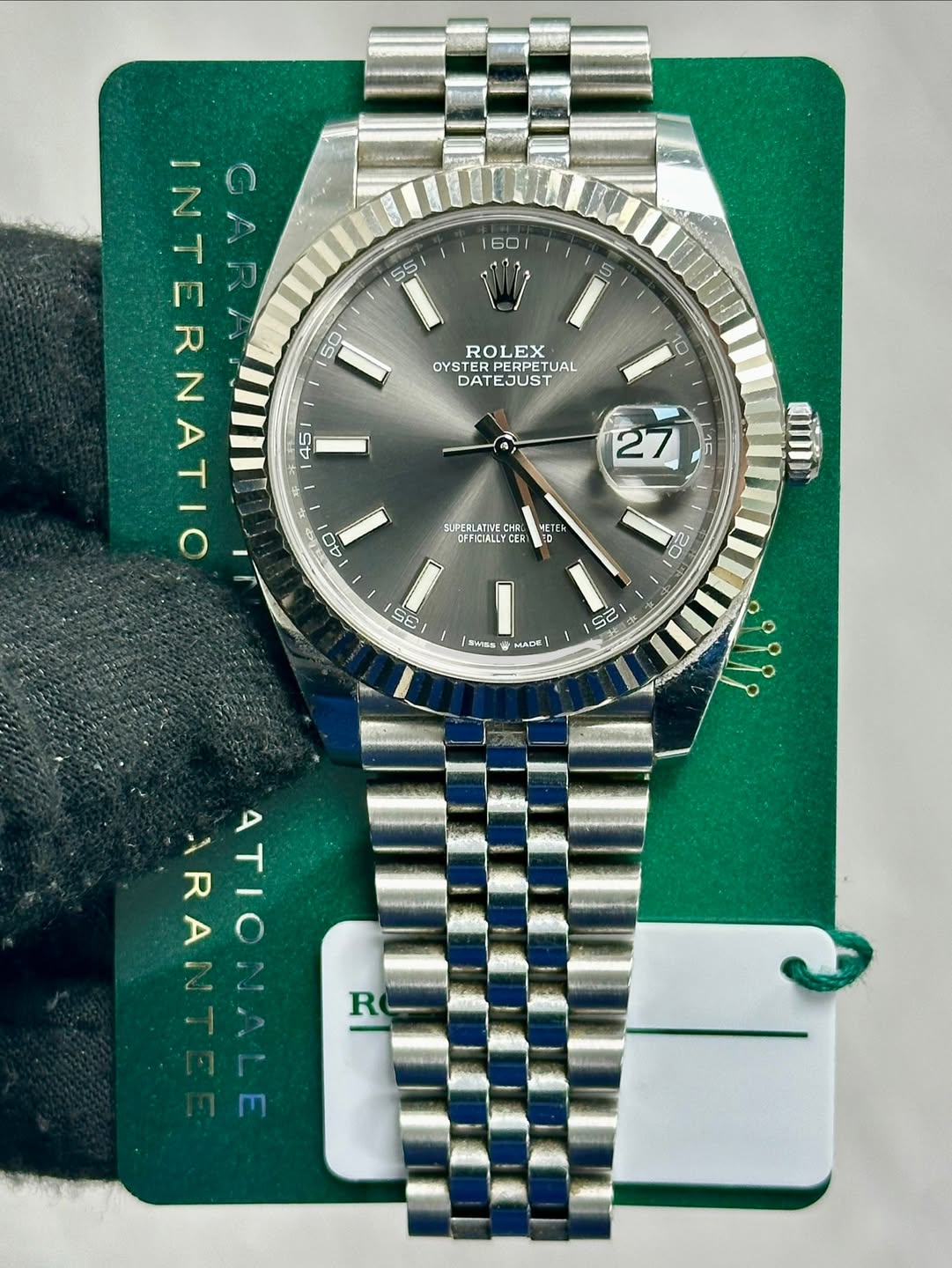 May be an image of wrist watch and text that says '60 5 ROLEX OYSTER OYTTUAL RPERPETUAL ETUAL DATEJUST 10 RNIM つム SUPERLATIVE HPA GU DFFICIALLY ETE 20 nil S6 GE aa MADE S の ៥ e…