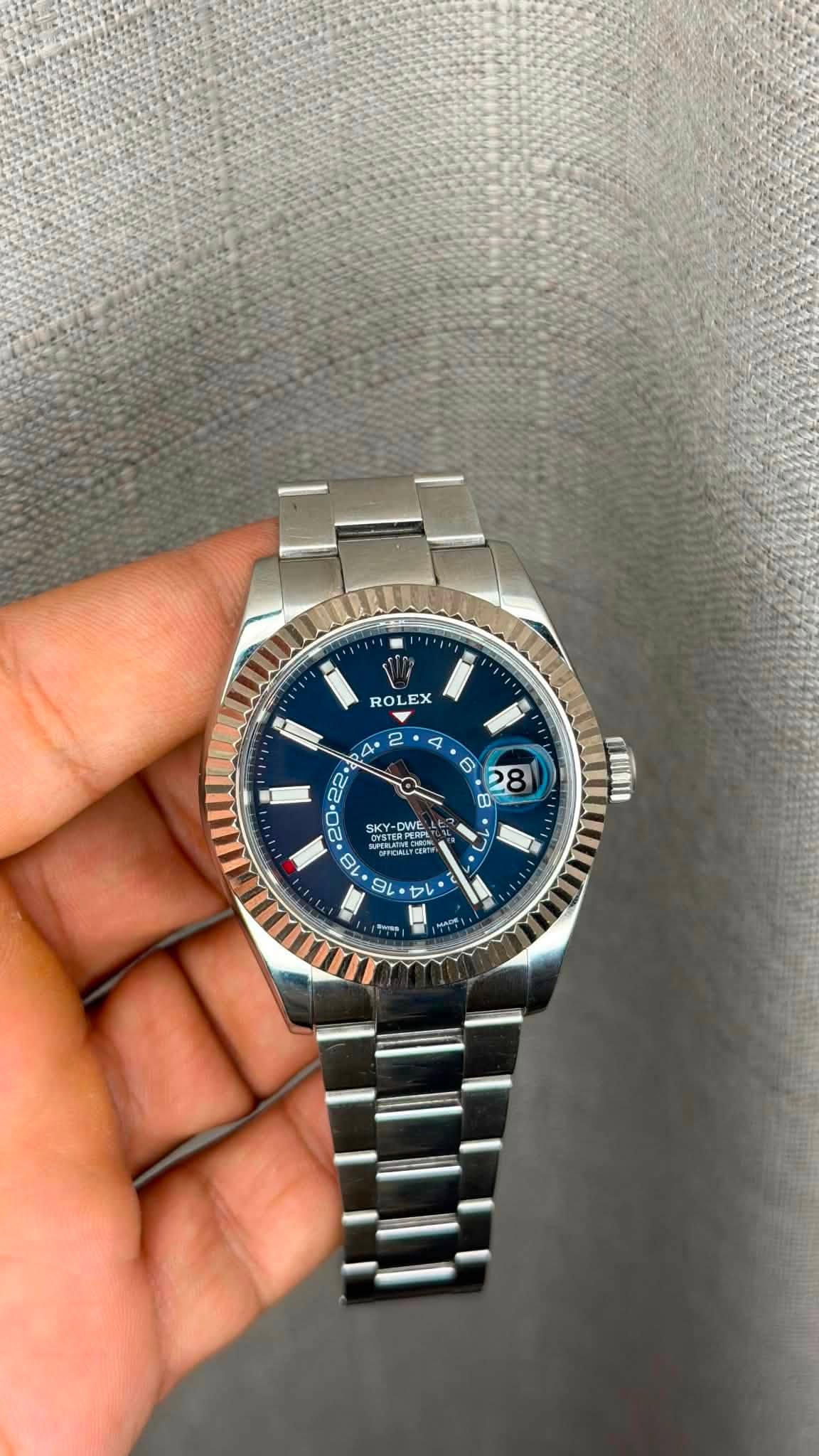 May be an image of wrist watch and text