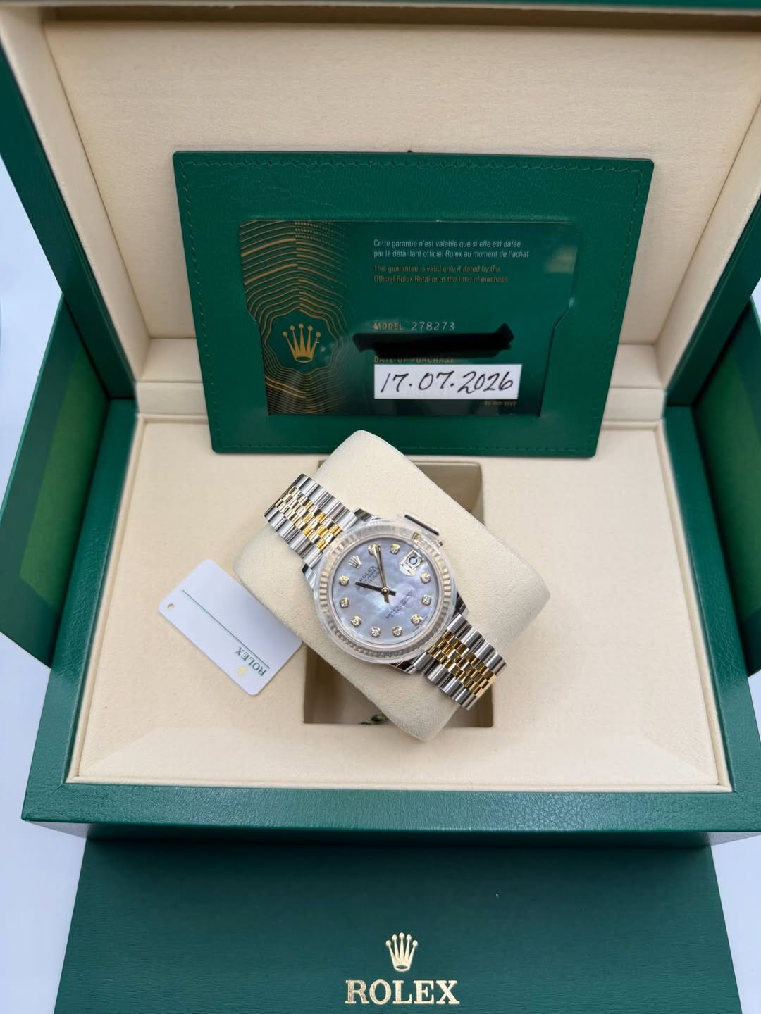 May be an image of wrist watch and text