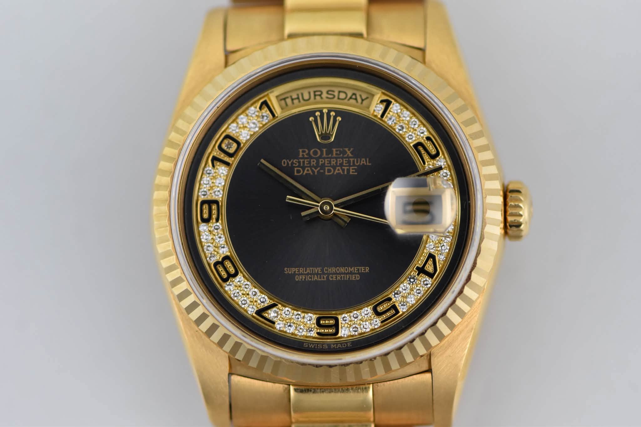 May be an image of wrist watch and text