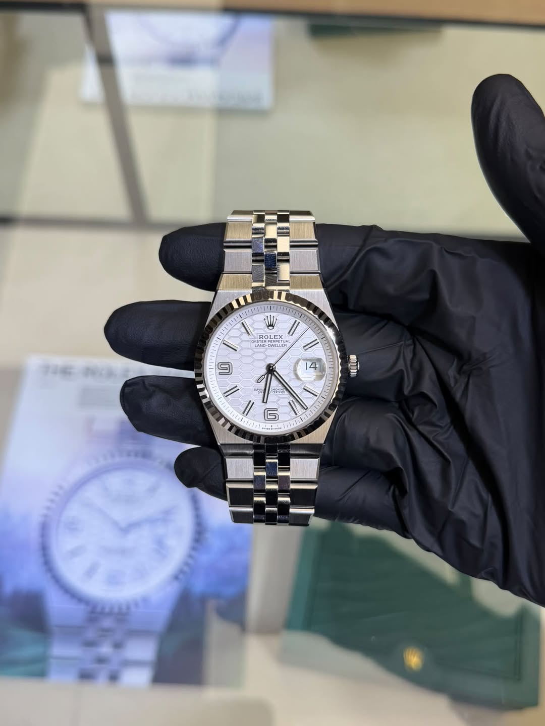 May be an image of wrist watch and text