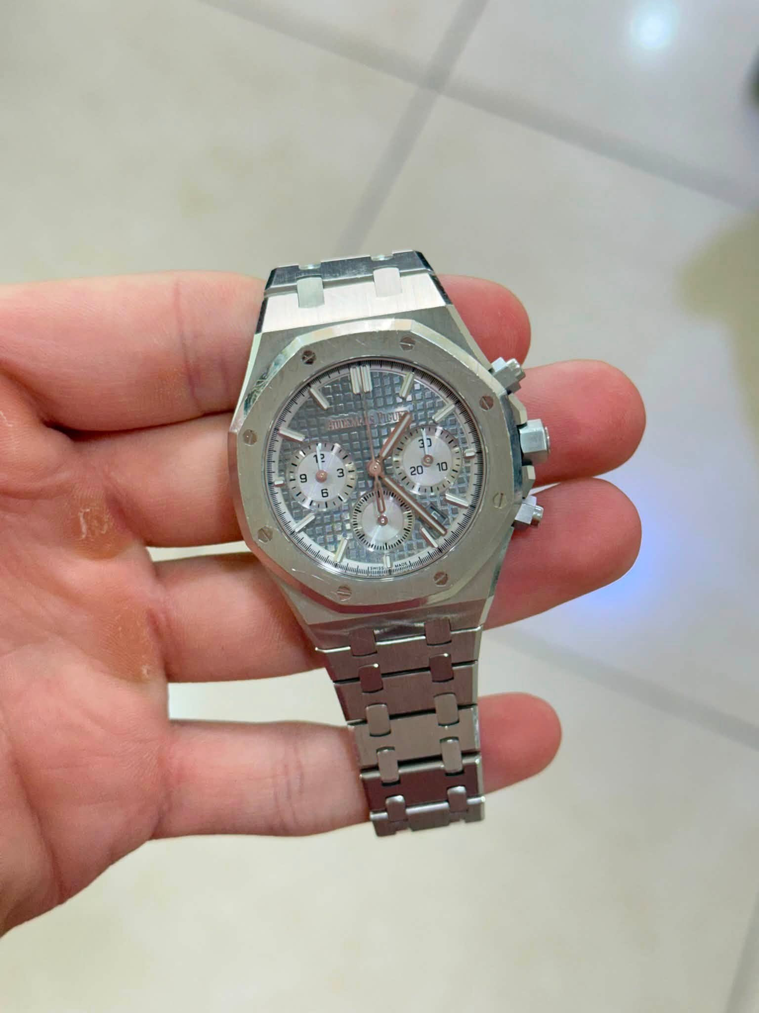 May be an image of wrist watch and text