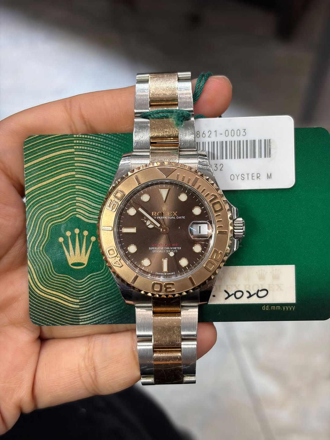 May be an image of wrist watch and text