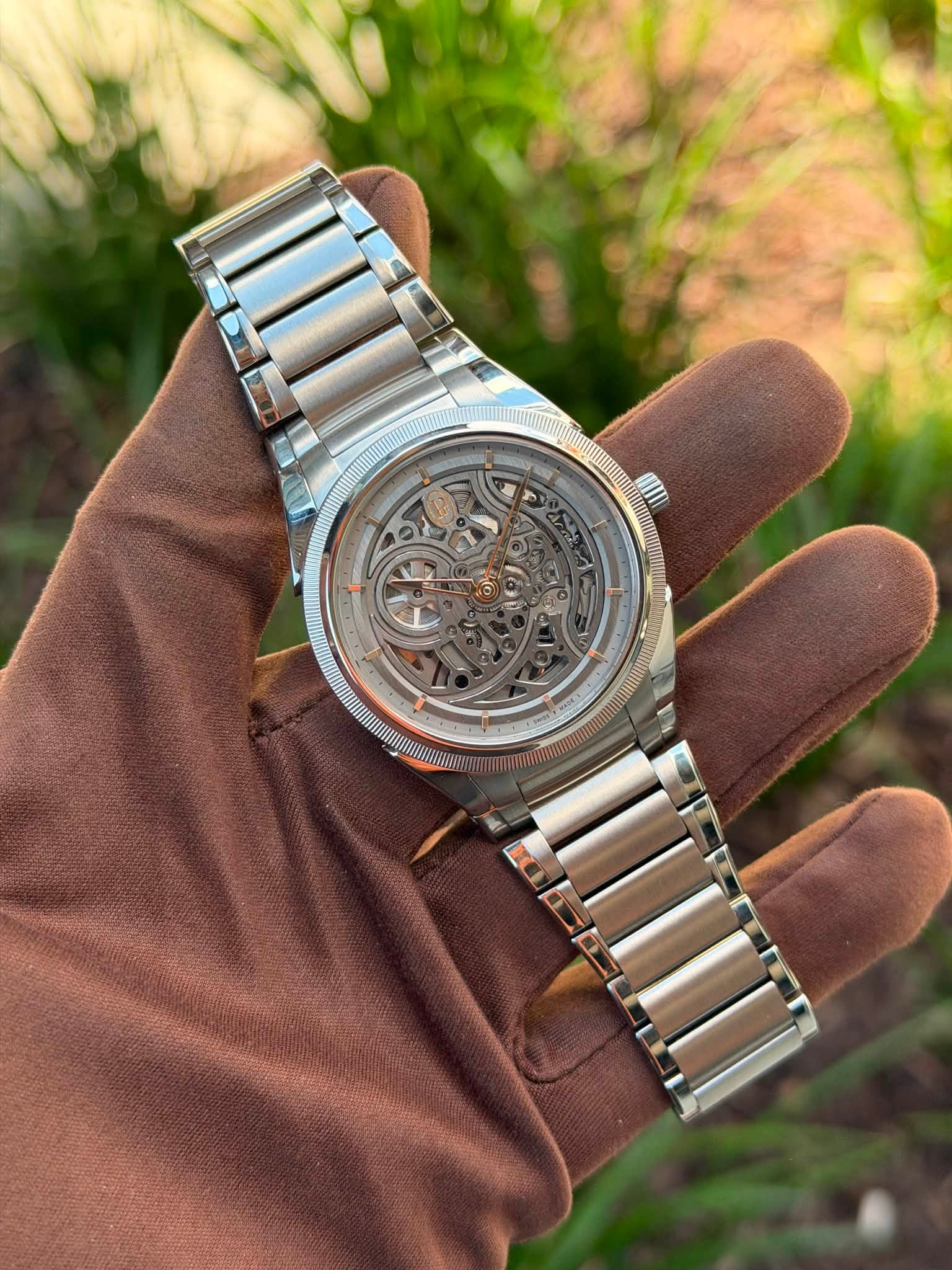 May be an image of wrist watch and text