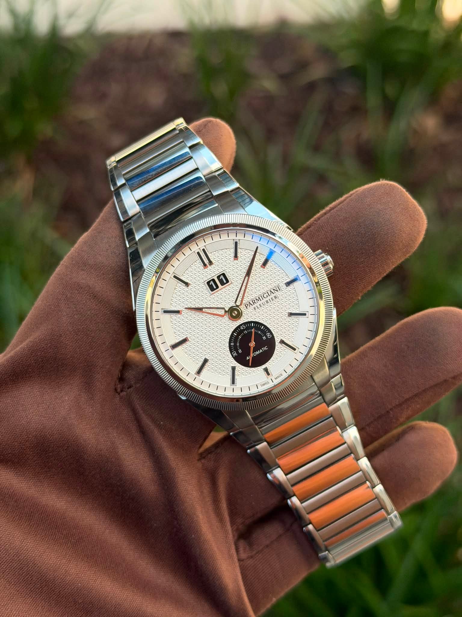 May be an image of wrist watch and text
