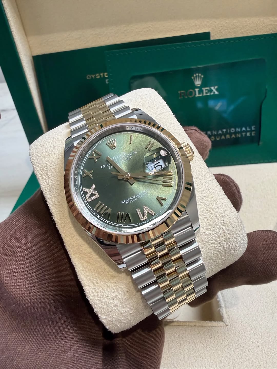 May be an image of wrist watch and text