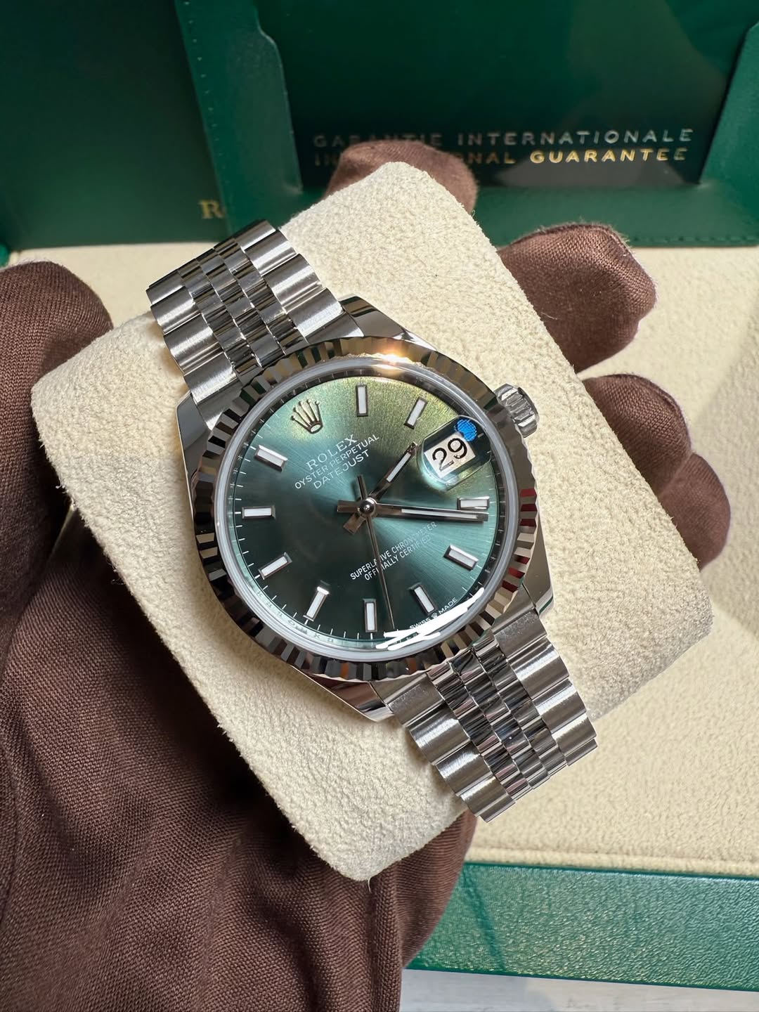 May be an image of wrist watch and text