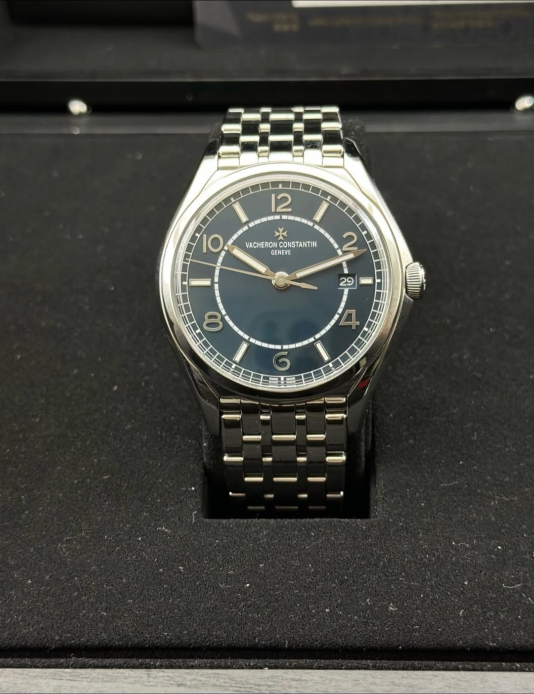 May be an image of wrist watch and text