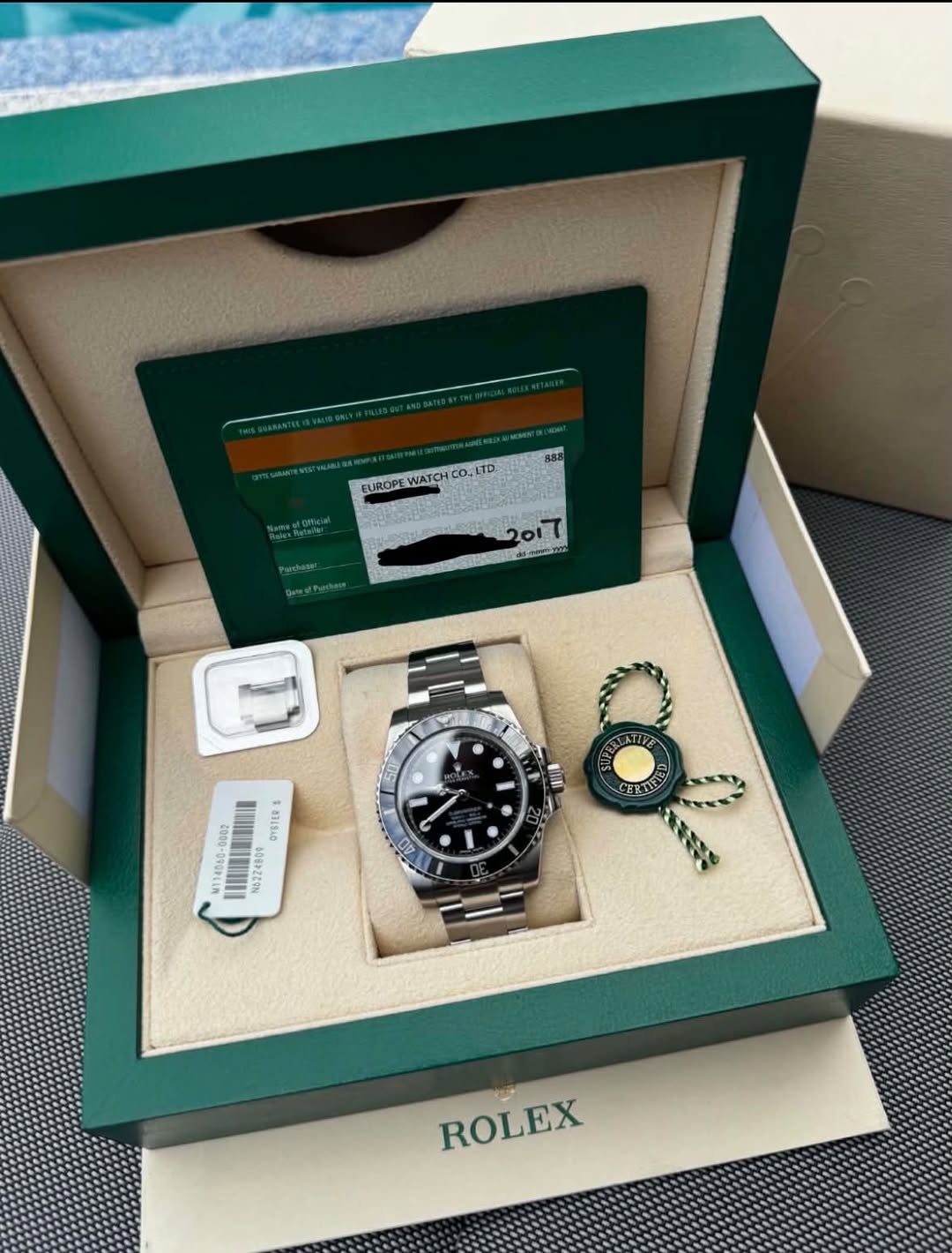 May be an image of wrist watch and text that says 'EUROP! EUROPEWATCHCO.LTD UROPEWATCH WATCH WATCHCO.LTD 2017 だ3 L M114068-D803 OYSTER N5224509 e A0 ROLEX'