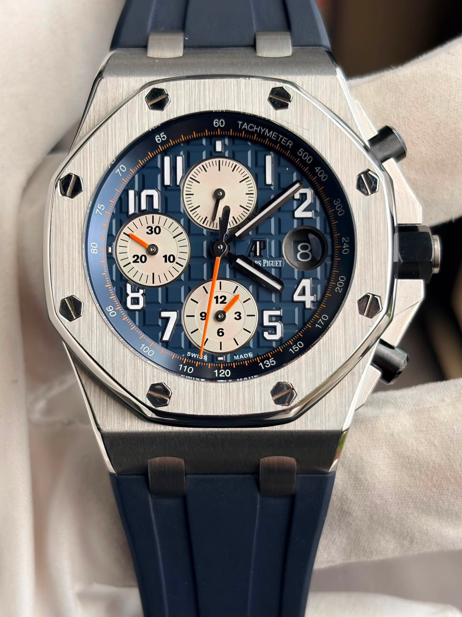 May be an image of wrist watch and text