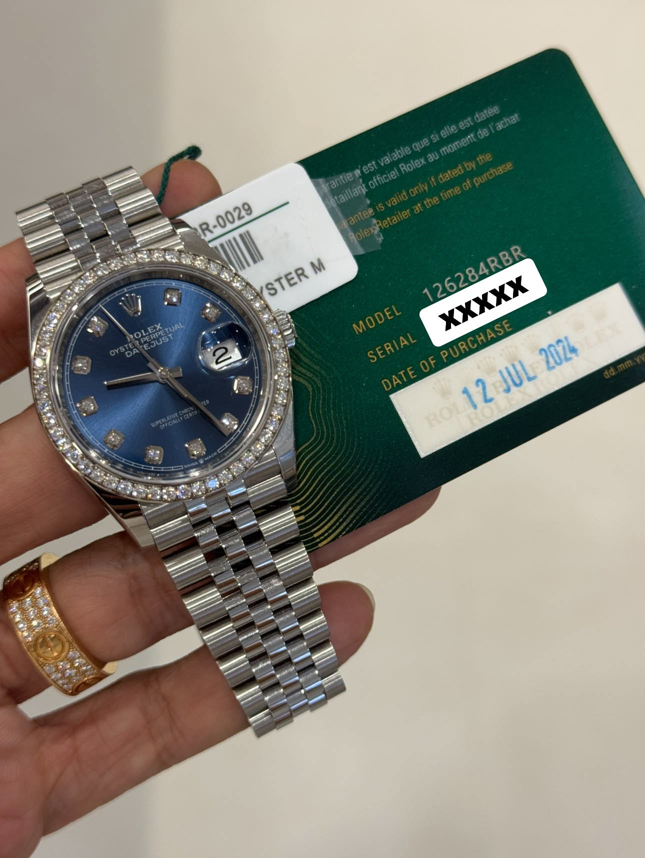 May be an image of wrist watch and text that says 'tai rantien Setaillant officiel R-0029 R-0029 STER M 2 126284RBR χXXXX MODE SERIAL 2024 ROL12 12JUL2024 12 JUL'