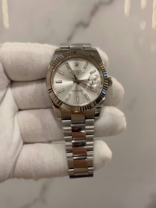 May be an image of wrist watch and text