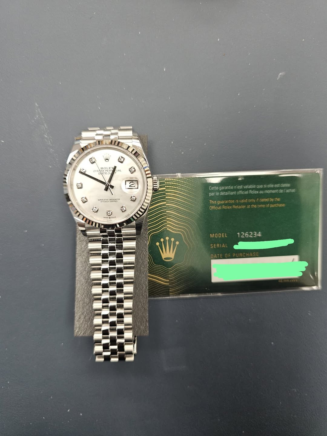 May be an image of wrist watch and text