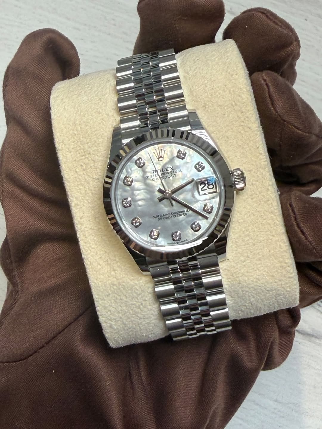 May be an image of wrist watch and text