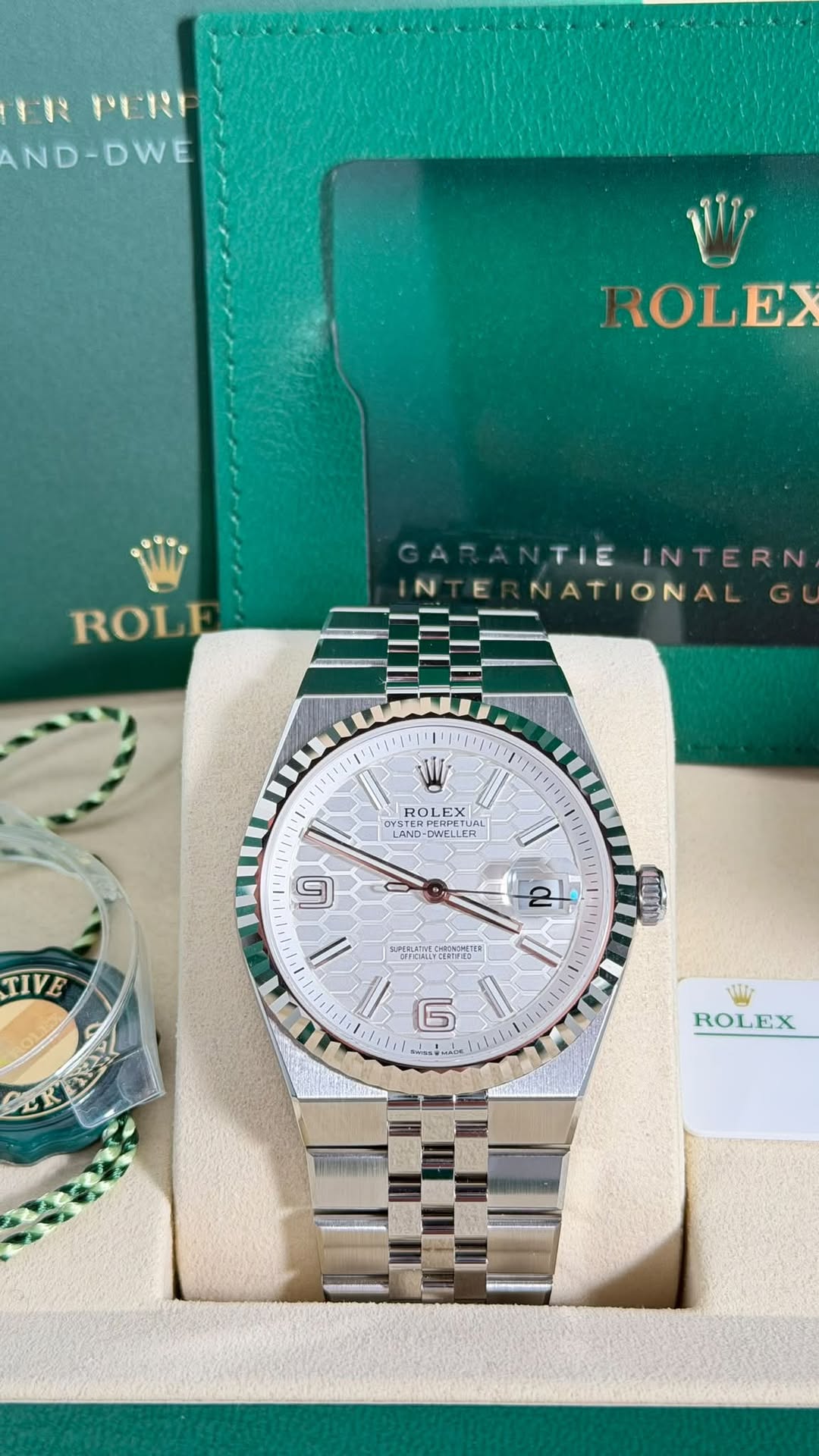 May be an image of wrist watch and text