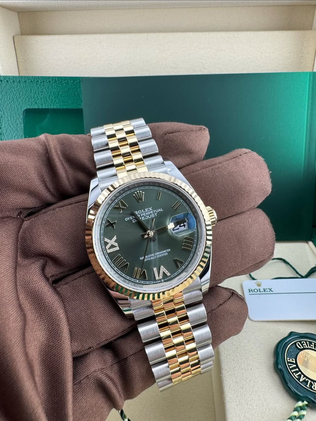 May be an image of wrist watch and text