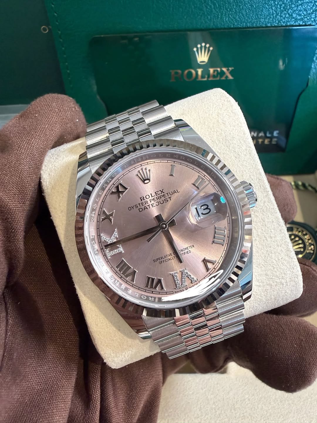 May be an image of wrist watch and text