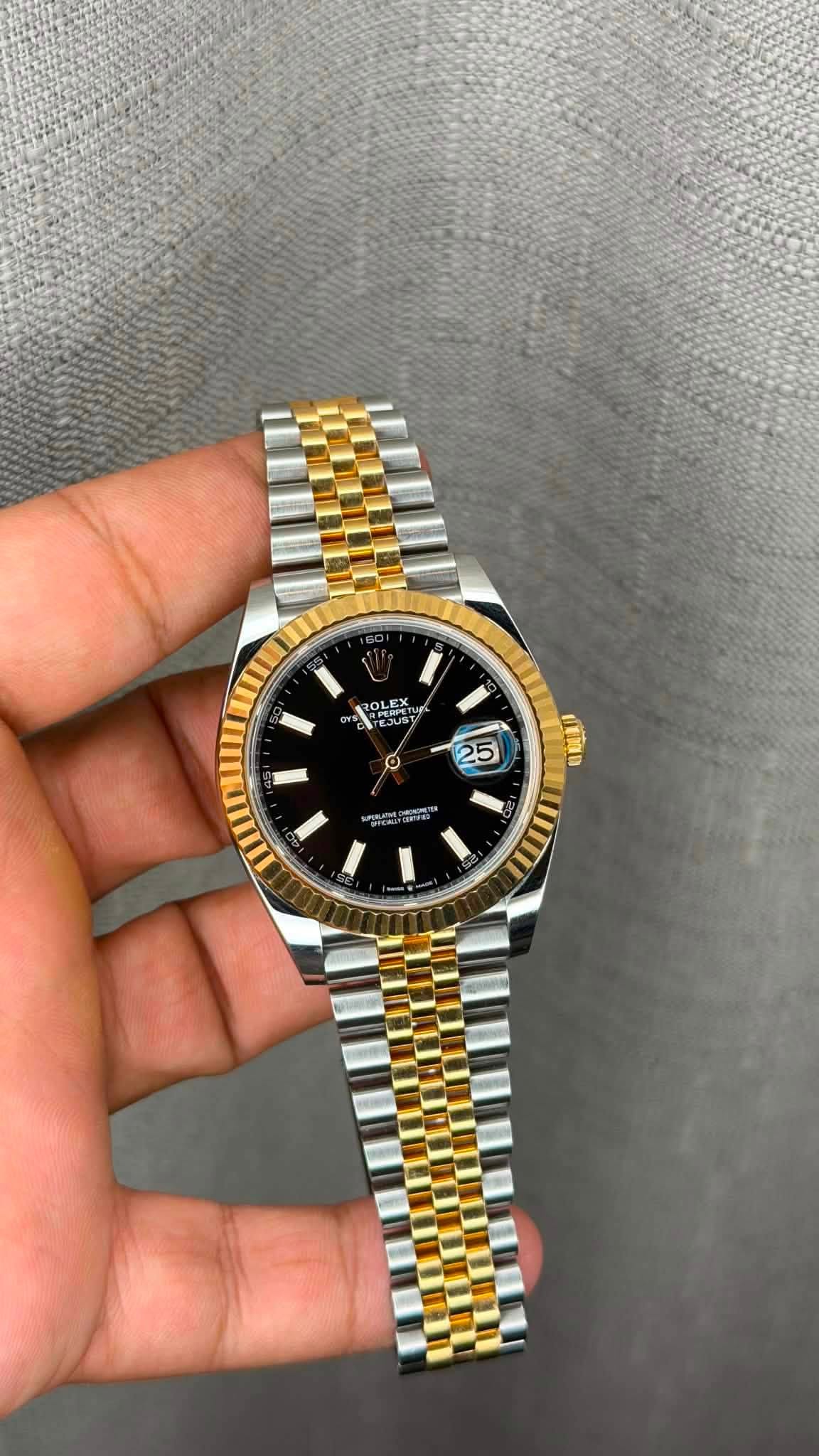 May be an image of wrist watch and text
