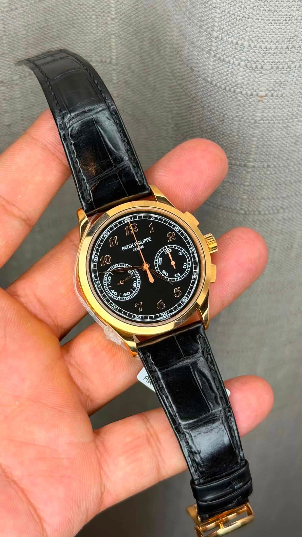 May be an image of wrist watch and text