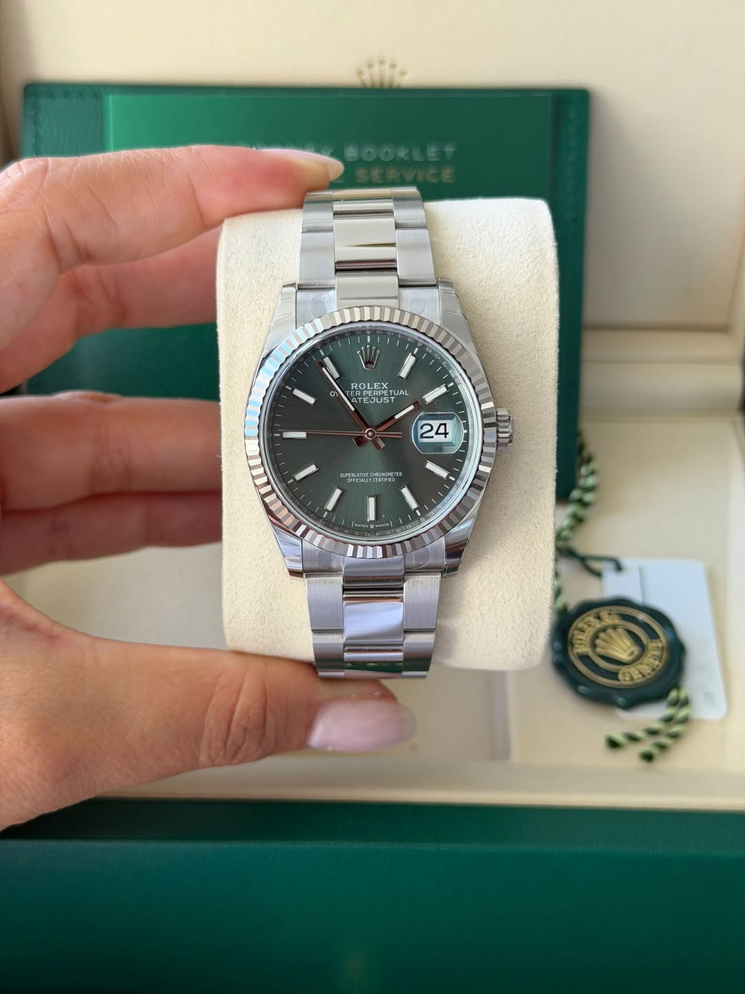 May be an image of wrist watch and text