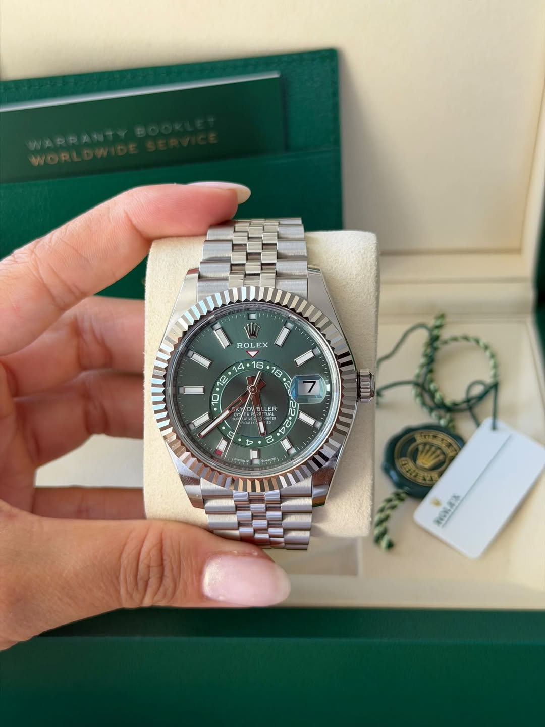 May be an image of wrist watch and text