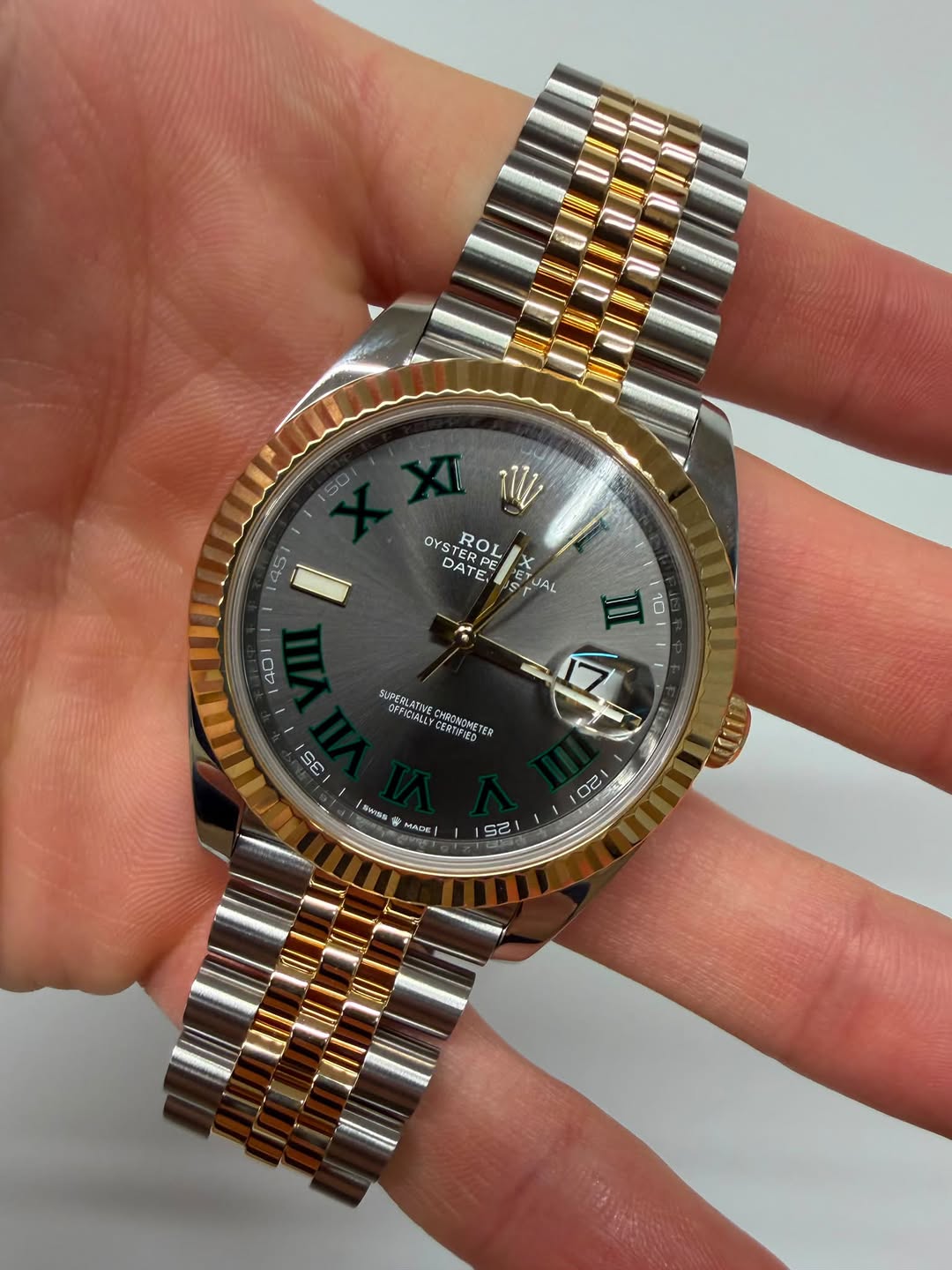 May be an image of wrist watch and text