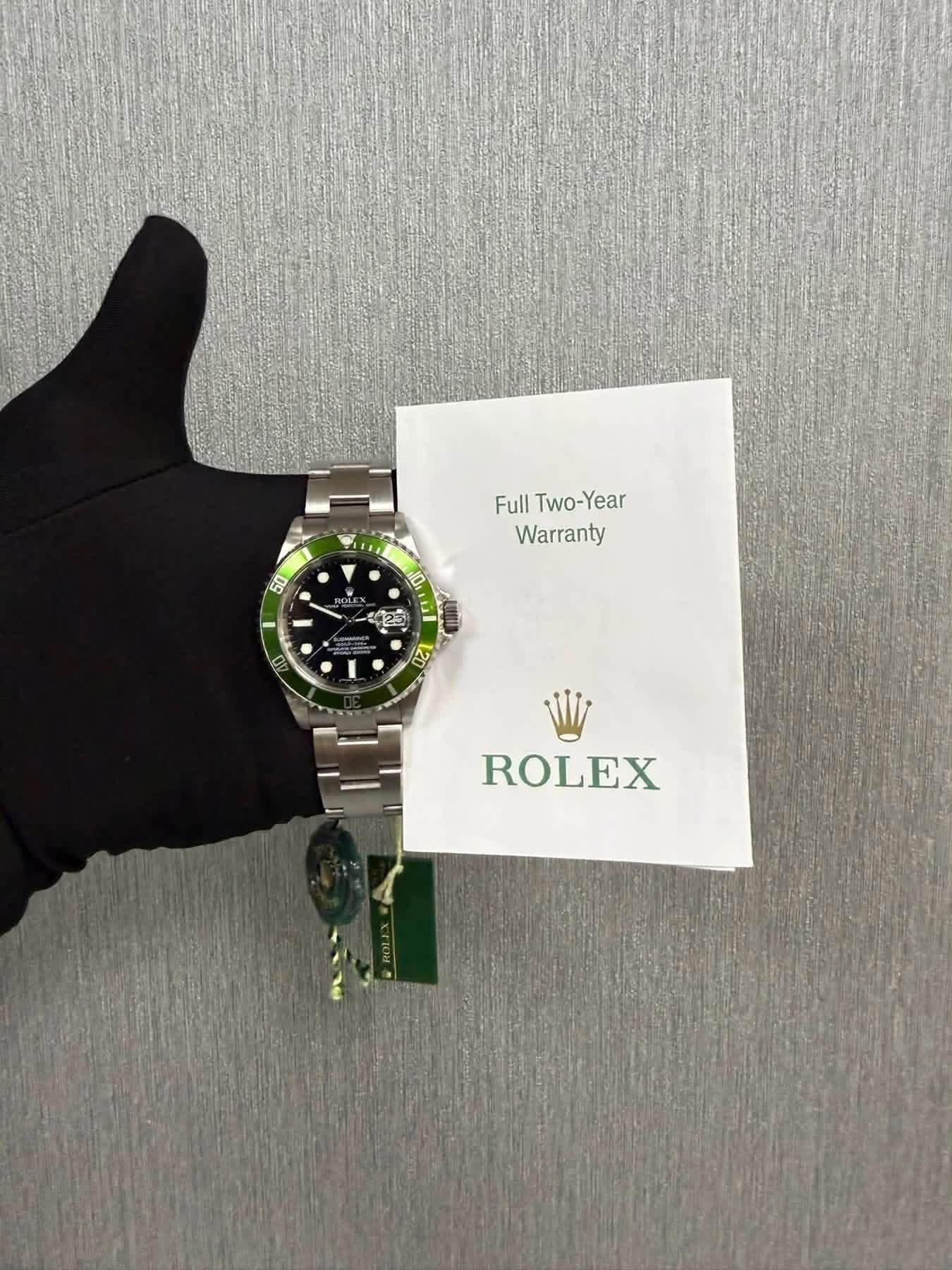 May be an image of wrist watch and text that says 'Full Two-Year Warranty 50 10 ፀር ROLEX'