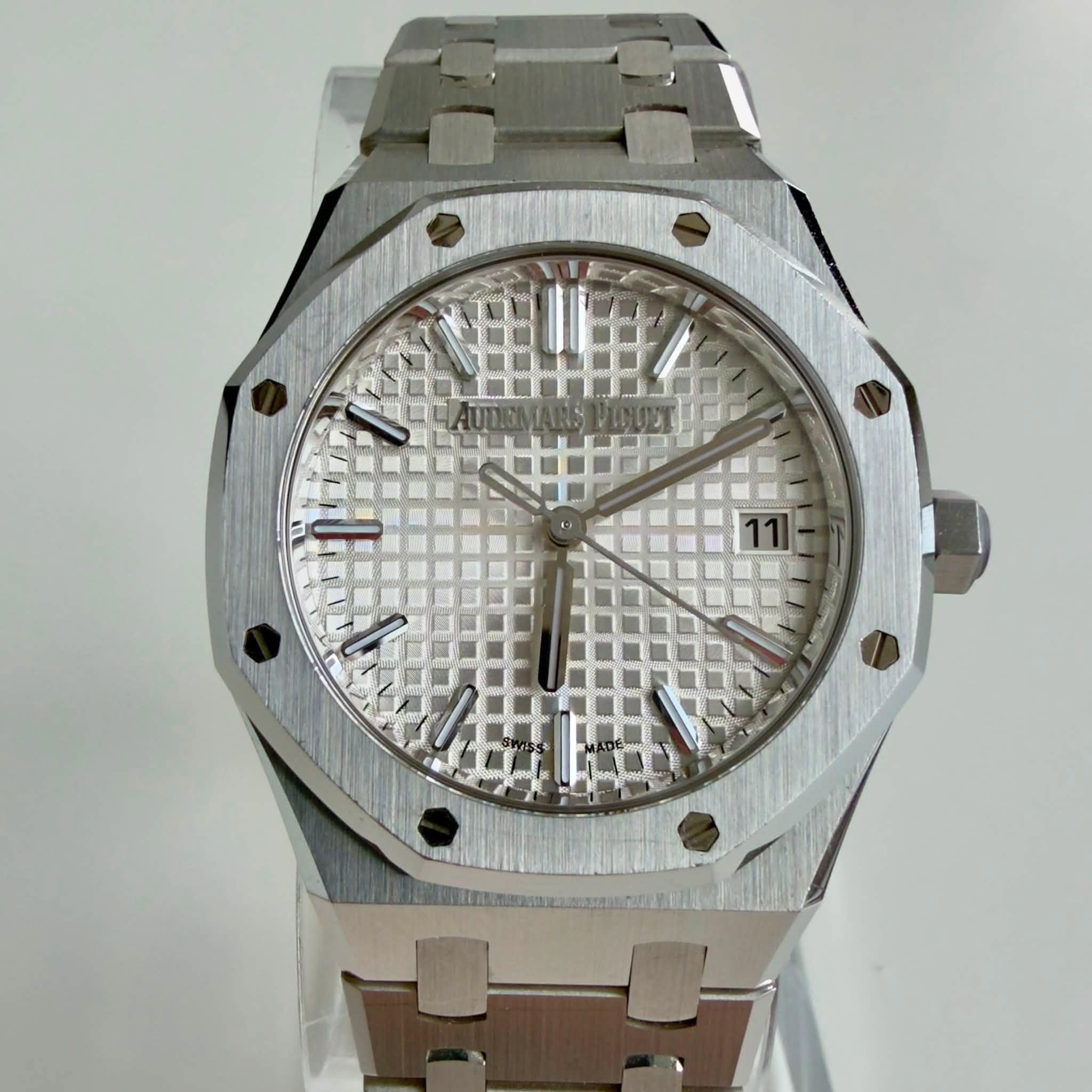 May be an image of wrist watch and text