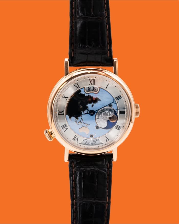 May be an image of wrist watch, map and text that says 'XII (6)5 6 XI X I د I MAHP VIII VII YO BANGE HONG HONGKONG KONG ٨'