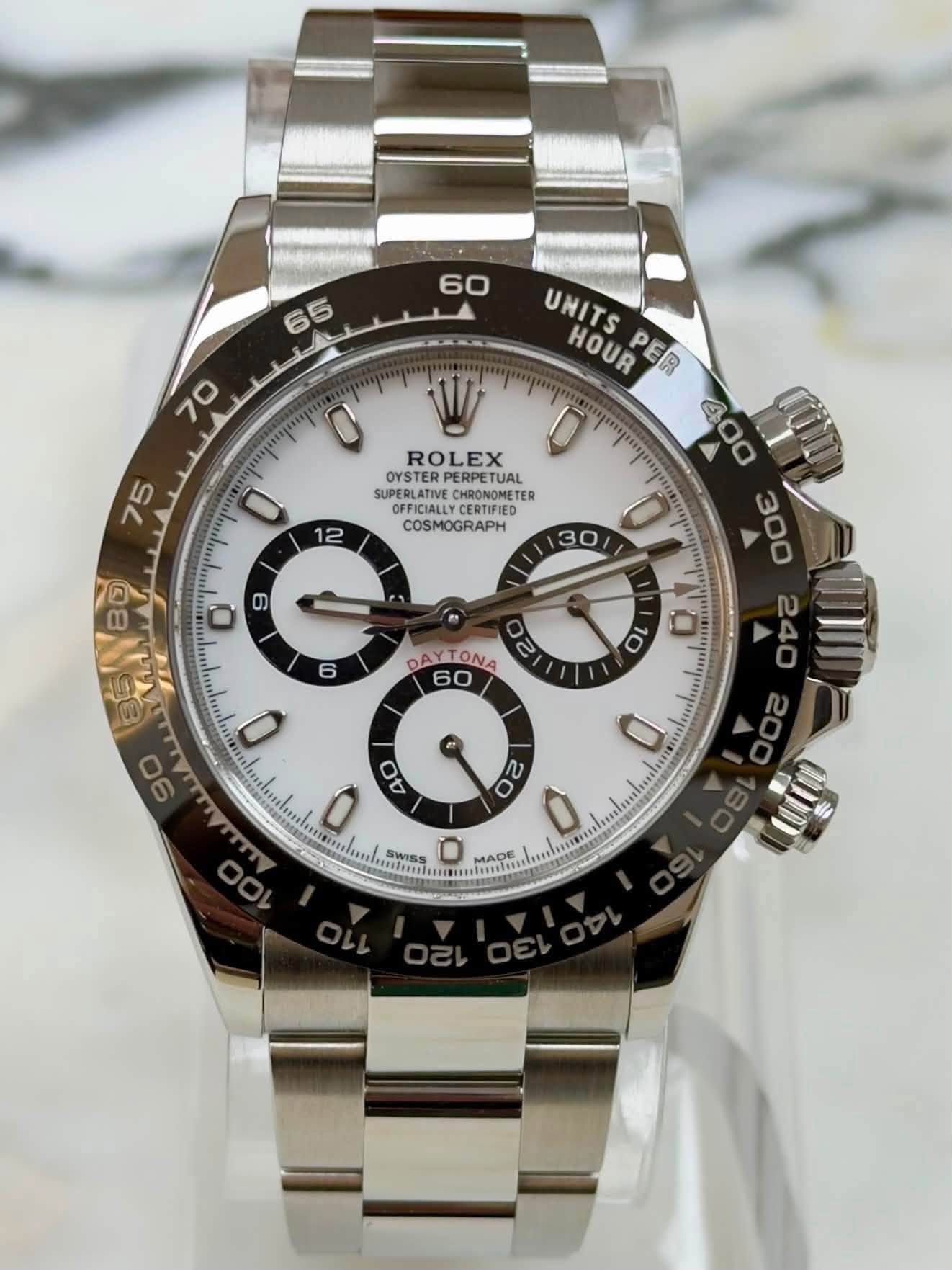 May be an image of wrist watch and text that says '60 65 70 ሞጣማ 0 ROLEX 0 12 OYSTERPERPETUAL OYSTER PERPETUAL OFFICIALLY HRONOMETE HRONOMETE PFICIALLYCERTIFIED CERTIFIED COSMOGRAPH…