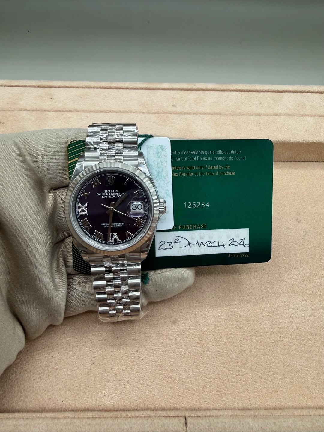 May be an image of wrist watch and text