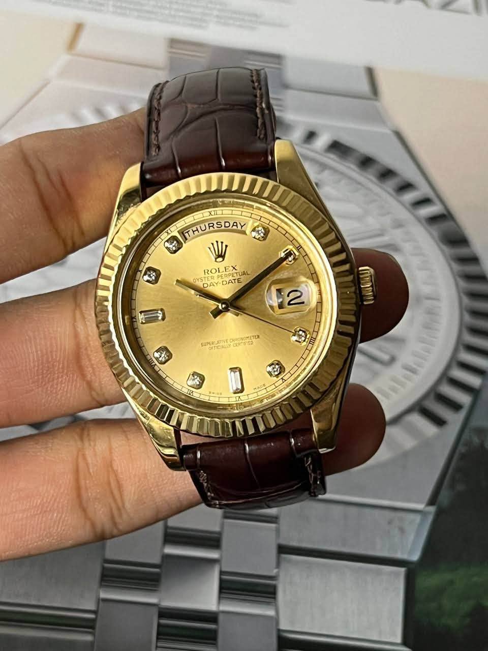 May be an image of wrist watch and text