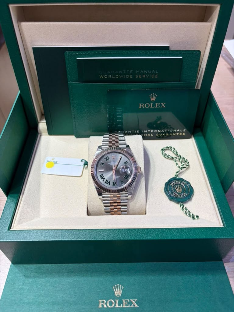 May be an image of wrist watch and text that says 'ROLEX INTERN ١ 12) nAnA = WA nΑ الل HOENE W ROLEX'