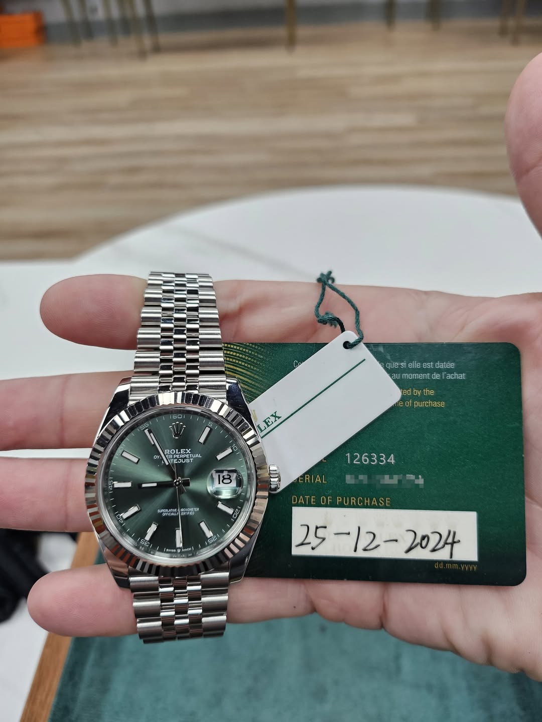 May be an image of wrist watch and text
