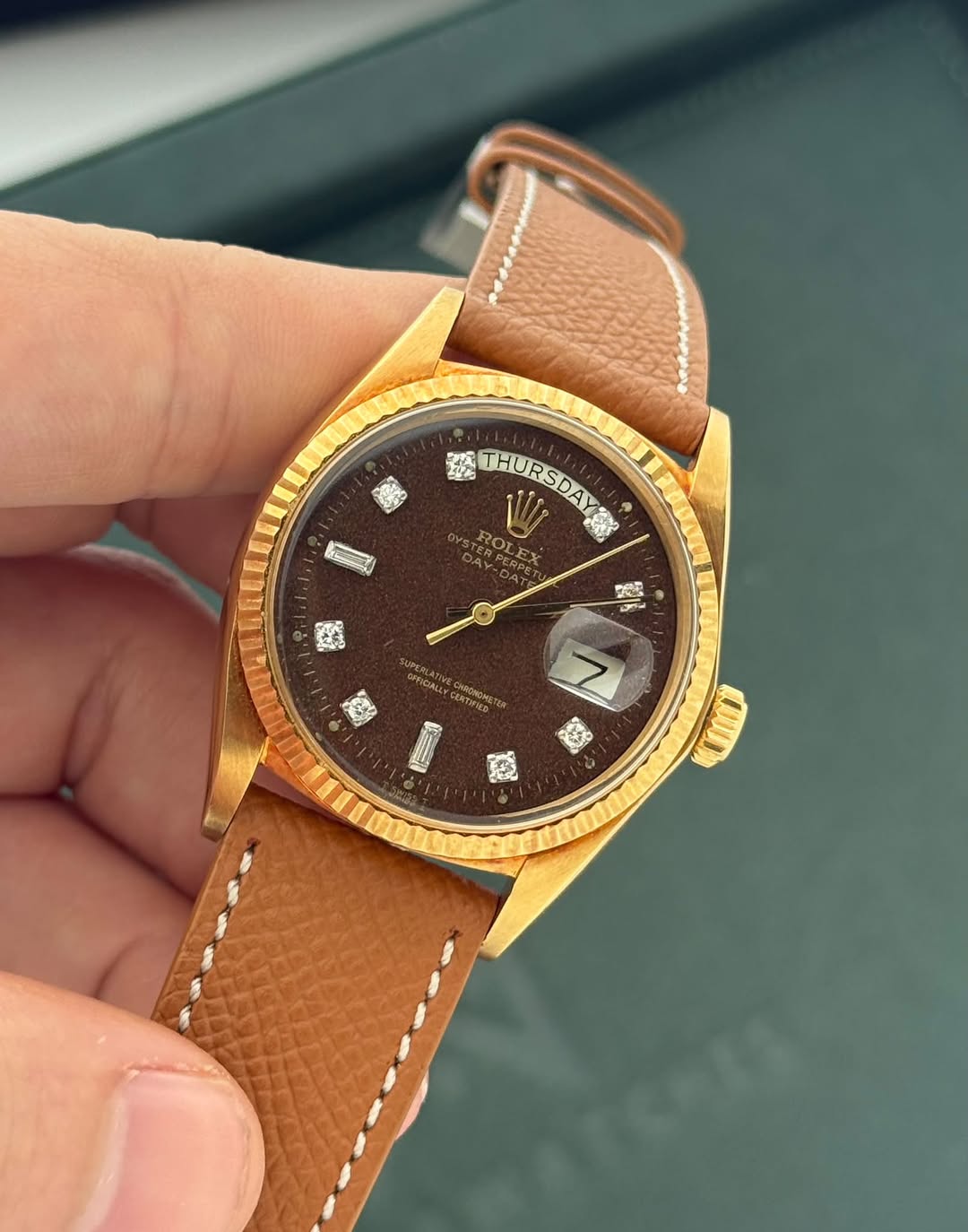 May be an image of wrist watch and text