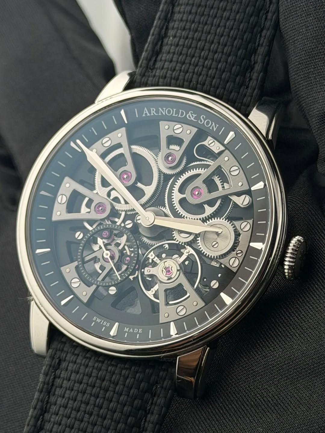 May be an image of wrist watch and text